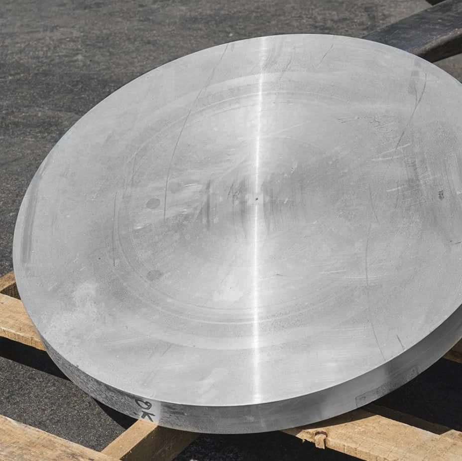A large stainless steel plate sitting on a pallet.