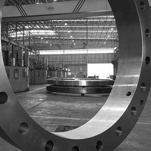 A black and white photo of a large steel flange.