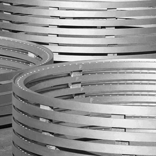 A black and white photo of a group of metal rings.