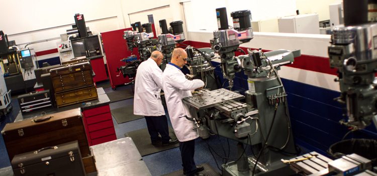 Two men working in a machine shop.