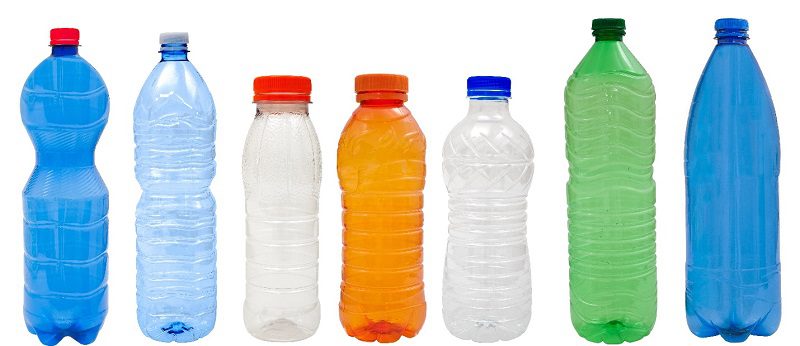 A row of plastic water bottles on a white background.