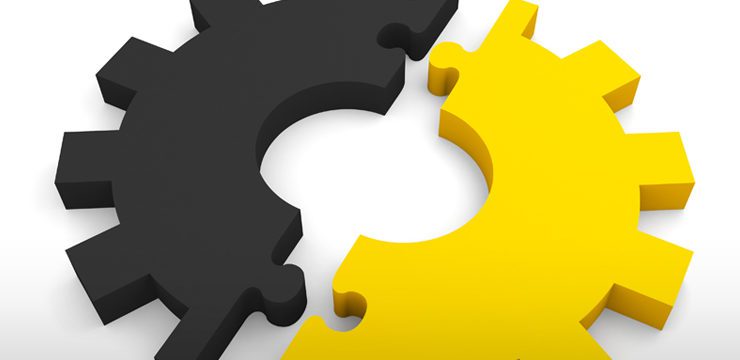 Two yellow and black gears on a white background.