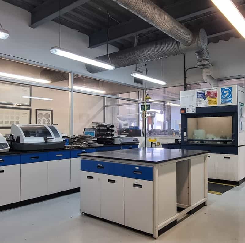 A lab with blue and white counter tops.