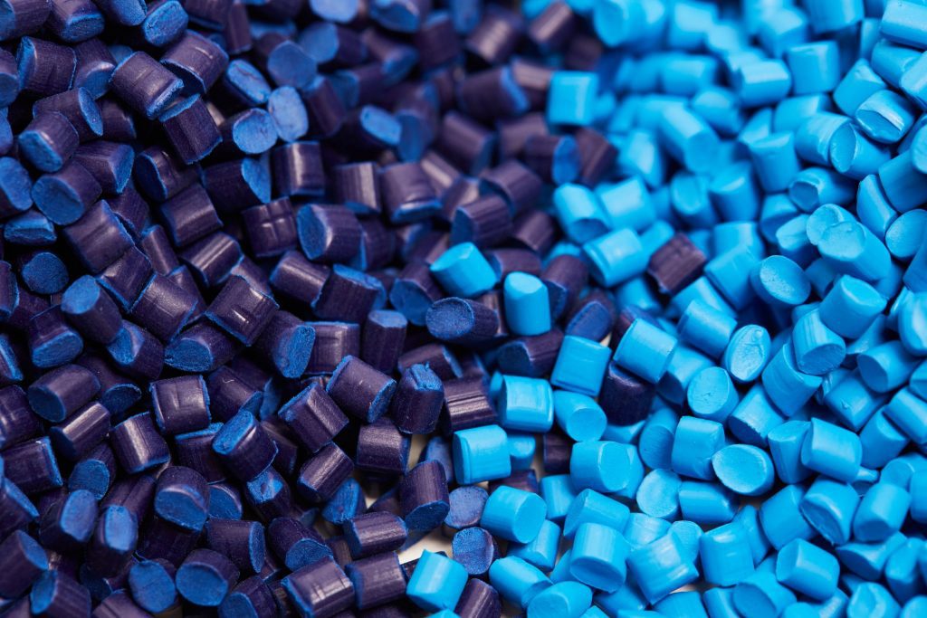 A pile of blue and purple plastic pellets.