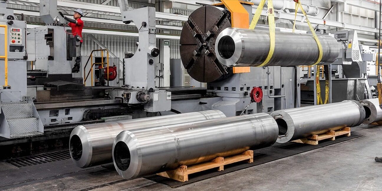 Worker operating heavy machinery in a factory.